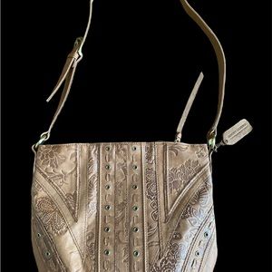 Leather embossed handbag. Great detail as shown.